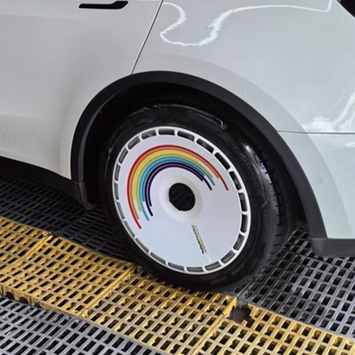 Variety of Tesla Model 3/Y custom wheel covers with unique designs and graphics.