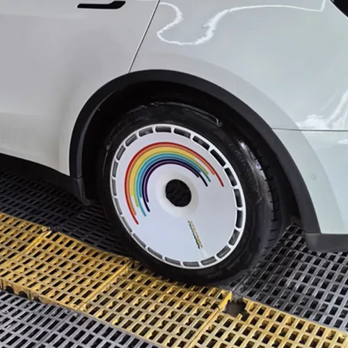 Variety of Tesla Model 3/Y custom wheel covers with unique designs and graphics.