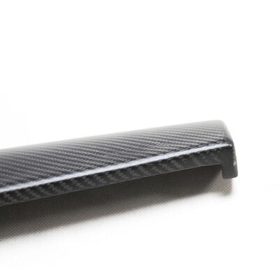 Close-up of a carbon fiber textured decorative sticker for Tesla Model 3/Y center console