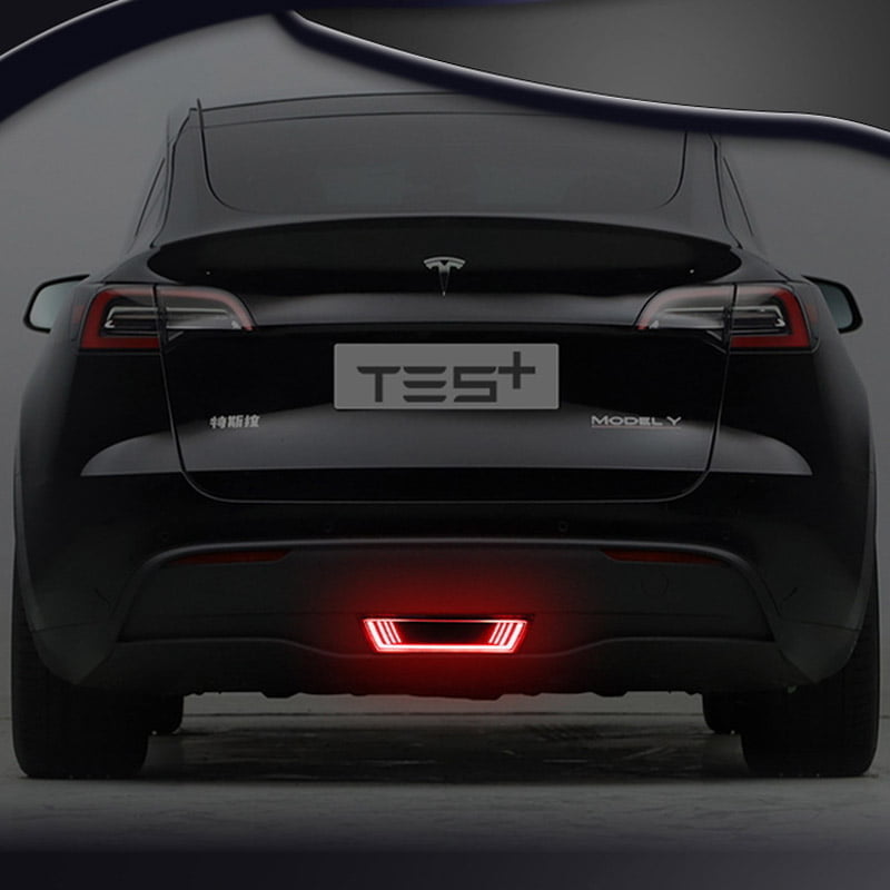 Tesla Model Y equipped with an enhanced safety light kit, showcasing a red glowing bar for increased visibility and safety
