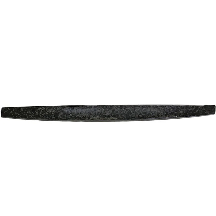 Close-up of a carbon fiber decorative dashboard strip for Tesla Model 3/Y, displaying a distinctive textured pattern for a stylish interior upgrade