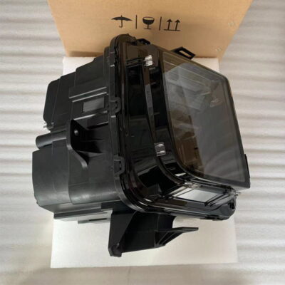 Top view of ideal electric car LED headlight assembly on white foam