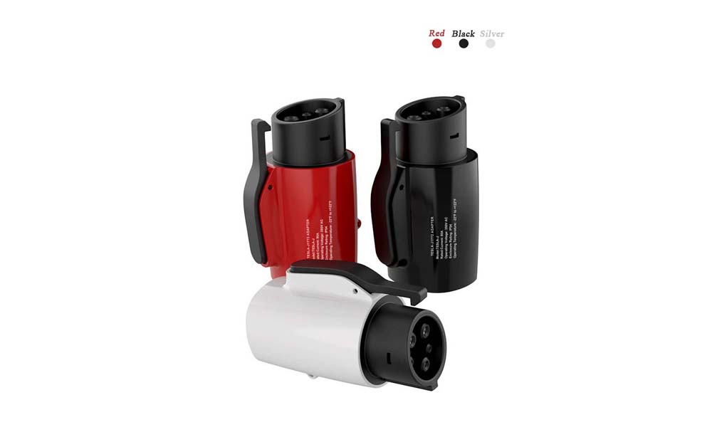 The image shows three Tesla Charger to J1772 adapters in different colors: red, black, and silver. These adapters allow Tesla charging cables to connect with J1772 plugs, enabling compatibility with various electric vehicles that use the J1772 standard. The adapters are cylindrical with a sturdy build and feature a locking mechanism for secure attachment